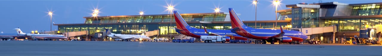 Commercial jets sitting at airport gates, Will Rogers World Airport, Southwest, United, American